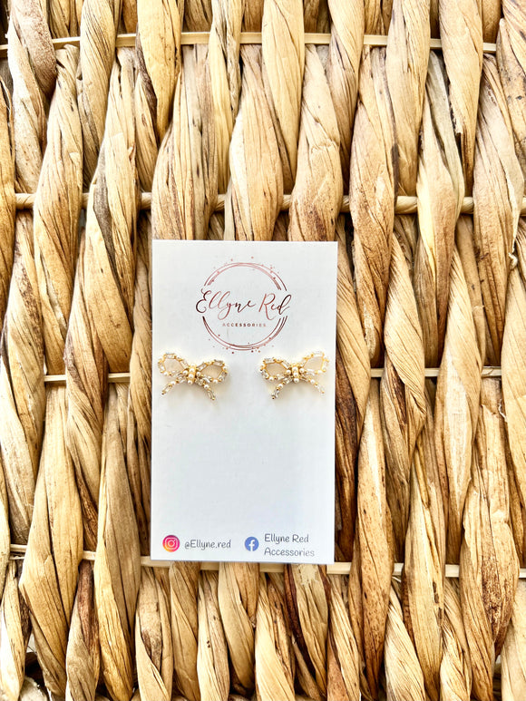 Gold pearl bow earrings